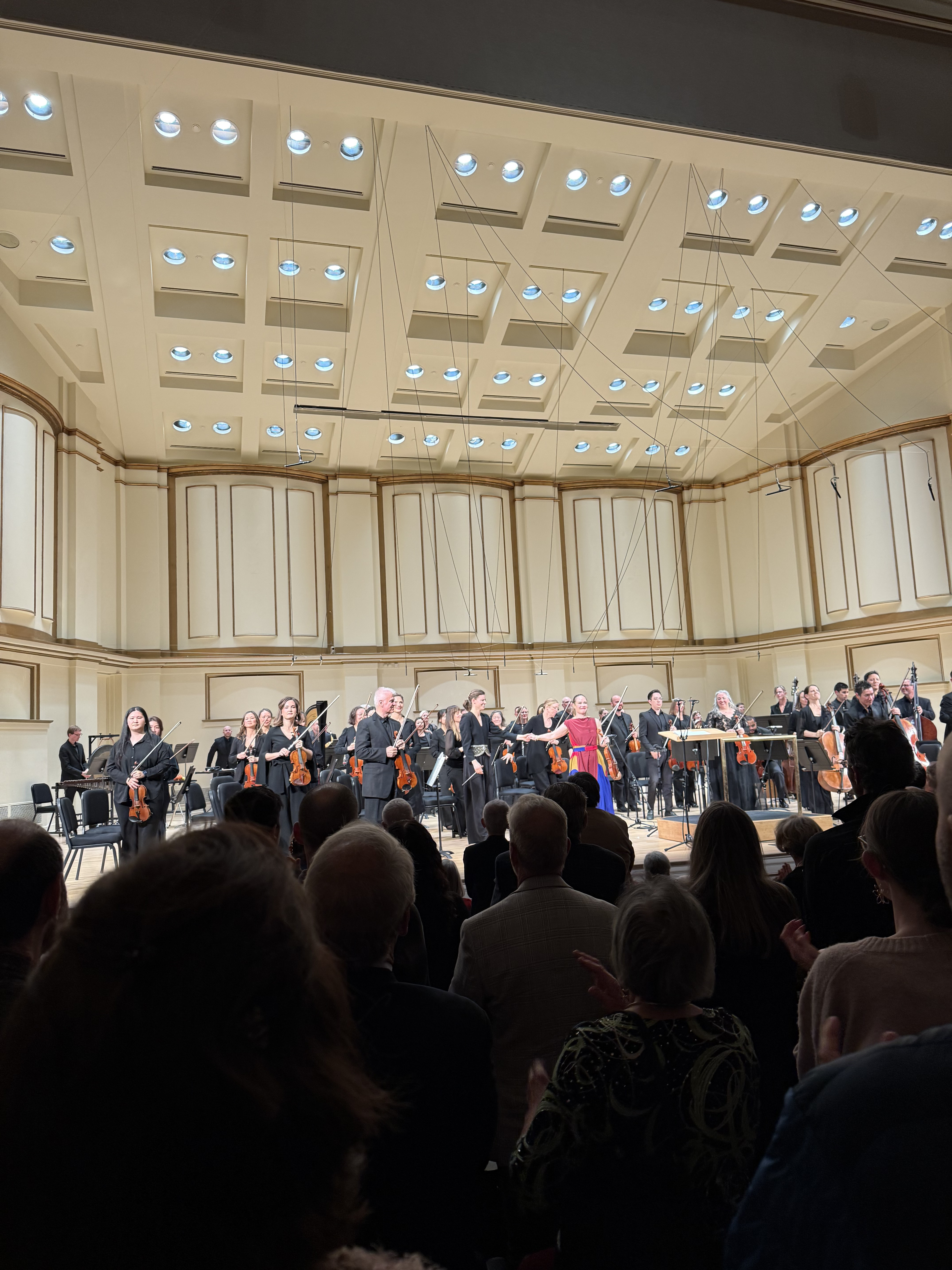 Leila Josefowicz taking a bow with the St. Louis Symphony Orchestra at Powell Hall
